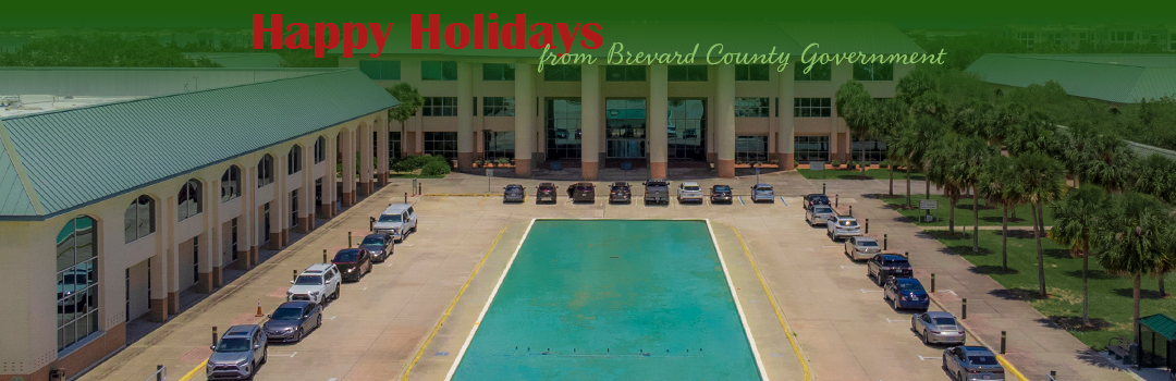 Happy holidays from Brevard County Governemnt over photo of the Viera Government Complex